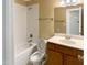 Well-lit bathroom with a shower-tub combo and a single sink vanity at 1201 Dagmar Ln, Wake Forest, NC 27587
