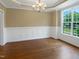 Dining room filled with natural light highlighting the crown molding and hardwood floors at 1201 Dagmar Ln, Wake Forest, NC 27587
