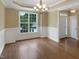 This dining room offers hardwood floors, chair railing and crown molding, plus great light at 1201 Dagmar Ln, Wake Forest, NC 27587