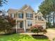 Charming two-story home with a manicured lawn and beautiful curb appeal at 1201 Dagmar Ln, Wake Forest, NC 27587