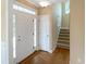 This foyer has hardwood floors, neutral walls, natural light and a staircase at 1201 Dagmar Ln, Wake Forest, NC 27587