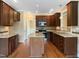 Spacious kitchen featuring granite countertops, stainless steel appliances, and wood cabinetry at 1201 Dagmar Ln, Wake Forest, NC 27587