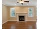 Cozy living room featuring hardwood floors and a charming fireplace at 1201 Dagmar Ln, Wake Forest, NC 27587