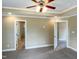 This main bedroom is spacious and offers neutral walls, carpet and an attached bathroom at 1201 Dagmar Ln, Wake Forest, NC 27587