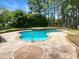 The in-ground pool features a custom patio and is fully fenced for privacy at 1201 Dagmar Ln, Wake Forest, NC 27587
