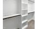 This walk-in closet has ample storage with shelving and rods for organizing clothes at 1201 Dagmar Ln, Wake Forest, NC 27587