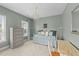 Comfortable bedroom with a decorative chandelier, window, and furniture at 124 Kingsport Rd, Holly Springs, NC 27540