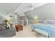 Bedroom featuring lamps, ceiling fan, and furniture at 124 Kingsport Rd, Holly Springs, NC 27540