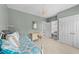 Comfortable bedroom with a decorative chandelier, window, and furniture at 124 Kingsport Rd, Holly Springs, NC 27540