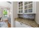 Charming butler's pantry with granite countertops, glass cabinets, and natural light at 124 Kingsport Rd, Holly Springs, NC 27540