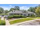 Exterior view of community pool house boasting well-kept landscape, sidewalk, and ample parking at 124 Kingsport Rd, Holly Springs, NC 27540