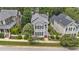 Charming home featuring a welcoming front porch, manicured landscaping, and a vibrant turquoise door at 124 Kingsport Rd, Holly Springs, NC 27540