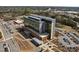 Exterior view of a hospital building with helipad, parking lots, landscaped grounds, and modern architectural design at 124 Kingsport Rd, Holly Springs, NC 27540