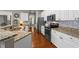 Bright kitchen with stainless steel appliances, granite countertops, and lots of cabinet space at 124 Kingsport Rd, Holly Springs, NC 27540