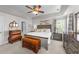 Comfortable main bedroom with a ceiling fan, chest, and natural light at 124 Kingsport Rd, Holly Springs, NC 27540