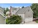 Exterior view of the home, highlighting the garage, landscaping, and architectural details at 124 Kingsport Rd, Holly Springs, NC 27540