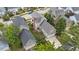 Aerial view showcasing the home's backyard, deck, garage, and surrounding greenery at 124 Kingsport Rd, Holly Springs, NC 27540
