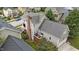 A well-maintained home exterior, featuring a deck, manicured lawn, and lush landscaping at 124 Kingsport Rd, Holly Springs, NC 27540