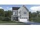 Charming two-story home showcasing a gray exterior, a front porch, an attached two-car garage, and a well-maintained lawn at 1240 Coral Cay Bnd, Wake Forest, NC 27587