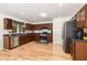 Nicely-appointed kitchen with stainless steel appliances and light wood flooring at 128 Palmdale Ct, Holly Springs, NC 27540