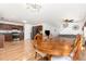 Spacious open-concept layout with hardwood floors connecting the kitchen, dining, and living areas at 128 Palmdale Ct, Holly Springs, NC 27540