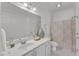 Bright bathroom offers a spacious vanity, ample storage, and a shower-tub combo at 1310 Durlain Dv # 103, Raleigh, NC 27614