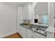 Well-maintained kitchen offering lots of cabinet space, a stainless steel sink, and a pass-through view to the living area at 1310 Durlain Dv # 103, Raleigh, NC 27614