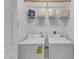 Functional laundry room is equipped with washer, dryer, shelving, and storage at 1310 Durlain Dv # 103, Raleigh, NC 27614