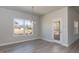 Bright dining room featuring a large window and glass door to outside deck at 148 Merrifield Ln # 128, Garner, NC 27529