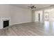 Open living space with fireplace, hardwood floors, and modern recessed lighting at 148 Merrifield Ln # 128, Garner, NC 27529
