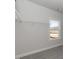 Walk-in closet with wire shelving and window at 148 Merrifield Ln # 128, Garner, NC 27529