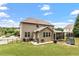 Spacious backyard with a well-maintained lawn, a fenced perimeter, and a screened porch, perfect for outdoor activities at 150 Saint Mellion St, Raleigh, NC 27603
