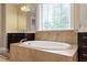 Bright bathroom features double vanities and a large soaking tub at 150 Saint Mellion St, Raleigh, NC 27603