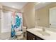 Clean and functional bathroom with a shower-tub combo and a vanity, offering essential amenities in a compact space at 150 Saint Mellion St, Raleigh, NC 27603