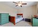 Inviting bedroom with a wooden bed, dresser, and playful decor, perfect for a comfortable and fun living space at 150 Saint Mellion St, Raleigh, NC 27603