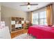 Bright and airy bedroom with hardwood floors, a cozy bed, and a storage shelf, creating a comfortable and organized space at 150 Saint Mellion St, Raleigh, NC 27603