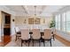 Formal dining area with hardwood floors, coffered ceiling, and plantation shutters at 150 Saint Mellion St, Raleigh, NC 27603