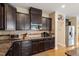 This kitchen features granite countertops, dark cabinets, stainless steel appliances and lots of storage space at 150 Saint Mellion St, Raleigh, NC 27603