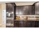 View of the gourmet kitchen showcasing the built in oven, granite countertops, and lots of storage at 150 Saint Mellion St, Raleigh, NC 27603