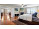 Bright main bedroom boasts a fireplace, sitting area and a glimpse of the upper hallway at 150 Saint Mellion St, Raleigh, NC 27603