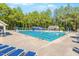 Community pool with multiple lap lanes and surrounding lounge chairs at 150 Saint Mellion St, Raleigh, NC 27603