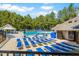 Community pool featuring lounge chairs and a recreation area, perfect for relaxation and fun at 150 Saint Mellion St, Raleigh, NC 27603
