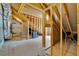 Unfinished attic with exposed beams and framed walls and wooden beams at 153 W Beech Slope Ct, Chapel Hill, NC 27517