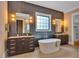 Bathroom boasts soaking tub, walk-in shower, stylish tile and natural light at 153 W Beech Slope Ct, Chapel Hill, NC 27517