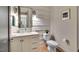 Charming bathroom with a marble countertop vanity, shiplap walls, and stylish fixtures at 153 W Beech Slope Ct, Chapel Hill, NC 27517
