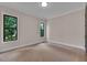 Bedroom featuring plush carpeting and large windows offering plenty of natural light at 153 W Beech Slope Ct, Chapel Hill, NC 27517