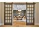 View of dining room showcasing modern light fixture and decorative wall hangings at 153 W Beech Slope Ct, Chapel Hill, NC 27517