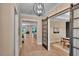 Open hallway showcasing hardwood floors and modern lighting fixtures at 153 W Beech Slope Ct, Chapel Hill, NC 27517