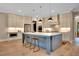 Spacious kitchen boasts a large island, stainless steel appliances, and modern pendant lighting at 153 W Beech Slope Ct, Chapel Hill, NC 27517