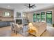 Bright living room with a fireplace, built-in shelves, and large windows at 153 W Beech Slope Ct, Chapel Hill, NC 27517